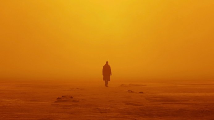 A lone figure in an orange landscape, reminiscent of Blade Runner 2049