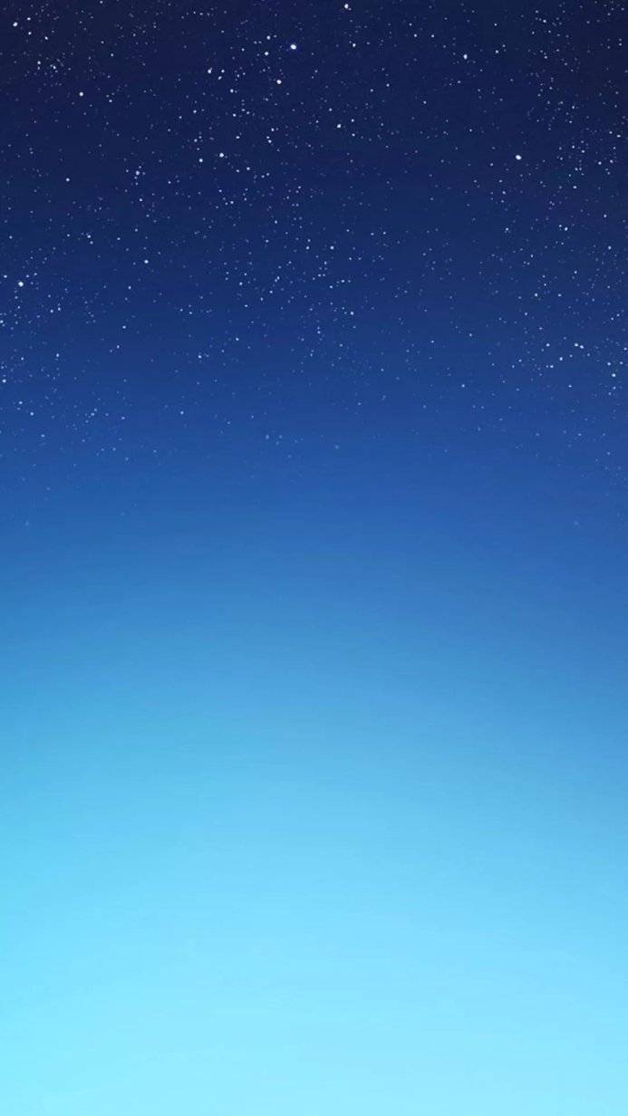 A smooth gradient from light blue to dark blue with white stars