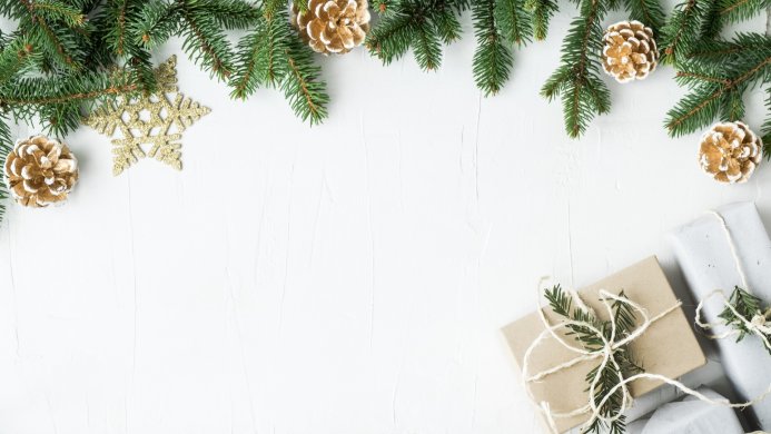 Christmas decoration with pine cones, fir branches, a star and gifts on a white background