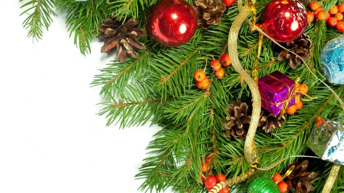 Christmas decorations with pine branches, balls and gifts on a white background