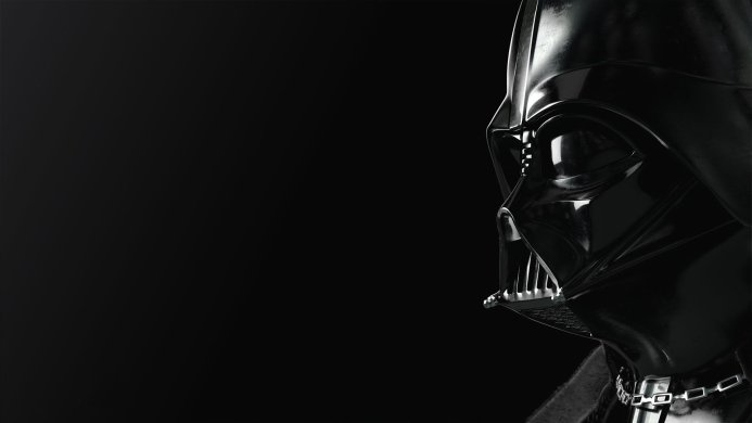 A profile view of Darth Vader's helmet from Star Wars against a dark background