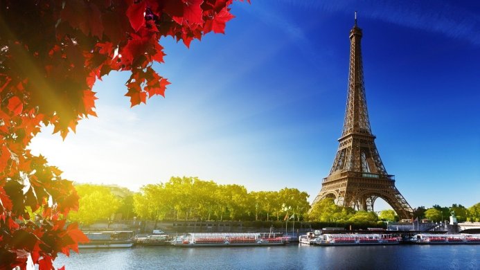Eiffel Tower in Paris with autumn foliage and river