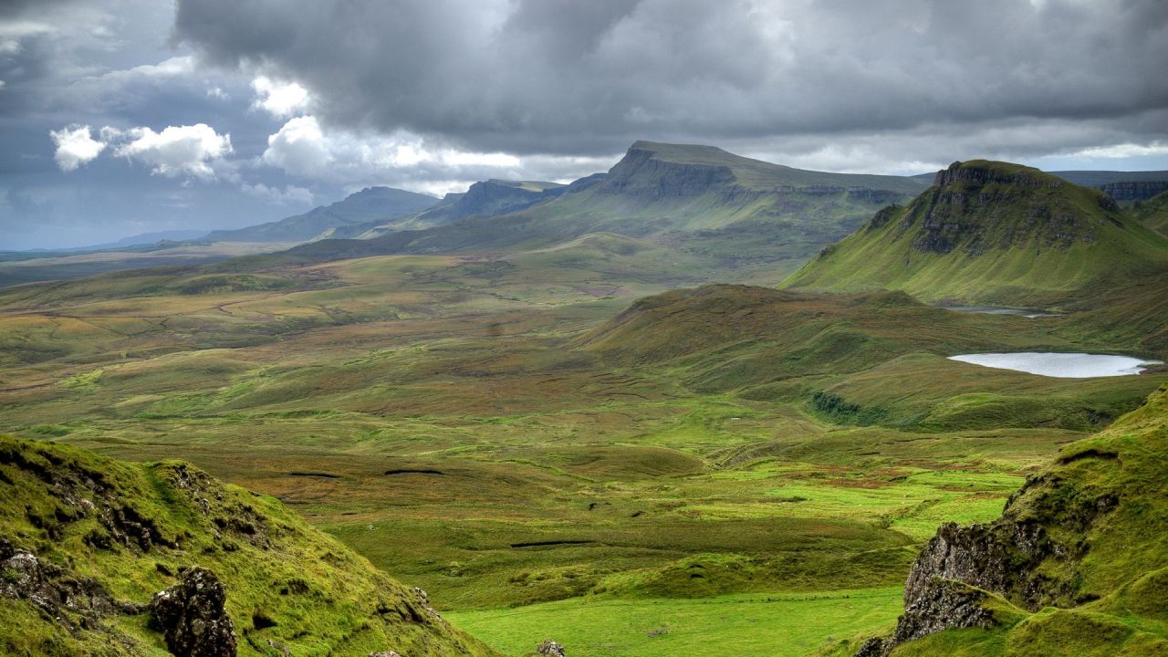 Green mountain landscape with cloudy sky