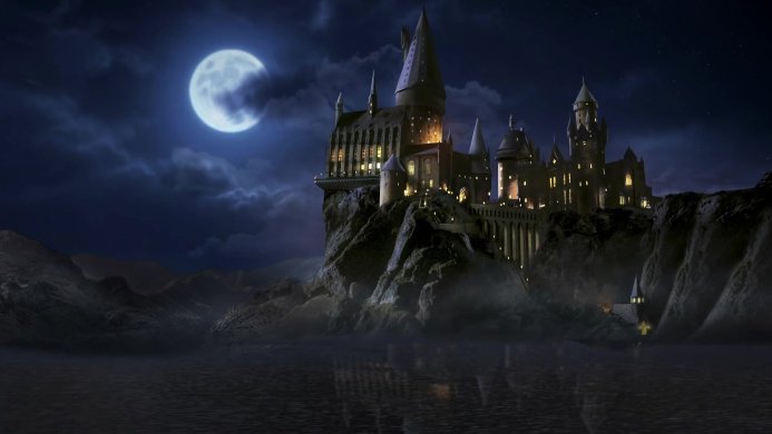 Hogwarts castle at night under a full moon from Harry Potter