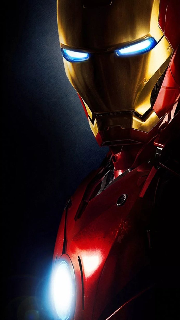 Close-up of Iron Man's helmet and arc reactor, red and gold armor