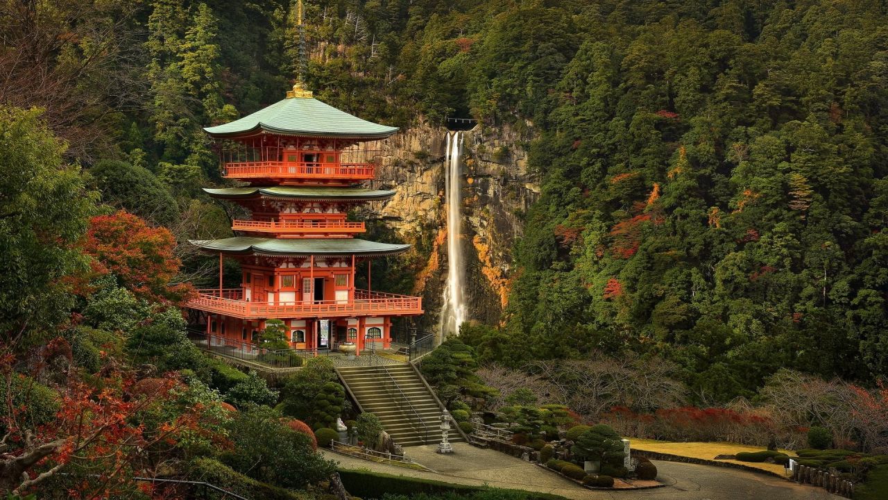 Red temple on the background of waterfall