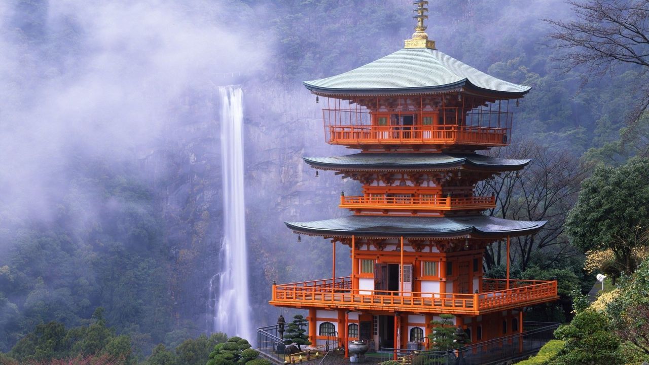 Japanese pagoda with waterfall background