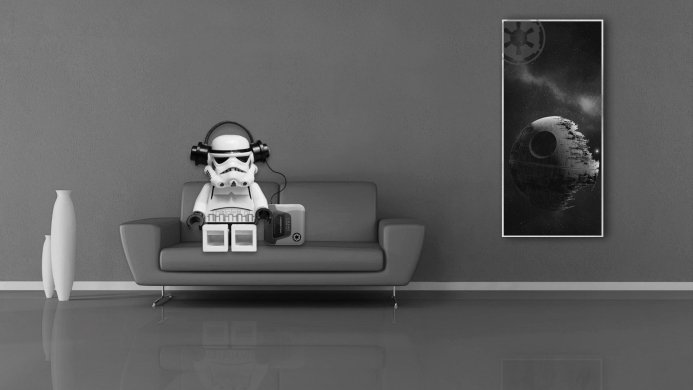Lego Stormtrooper listening to music on a couch with a Death Star poster in the background