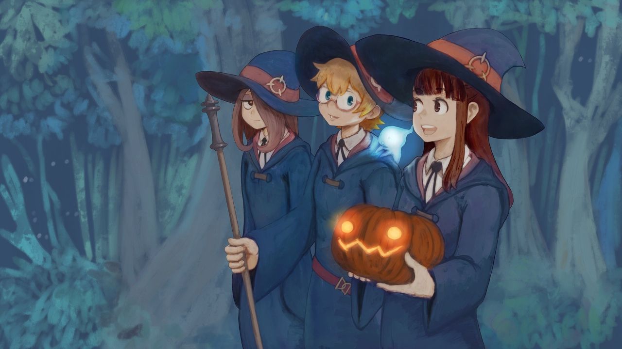 Three witches with a pumpkin
