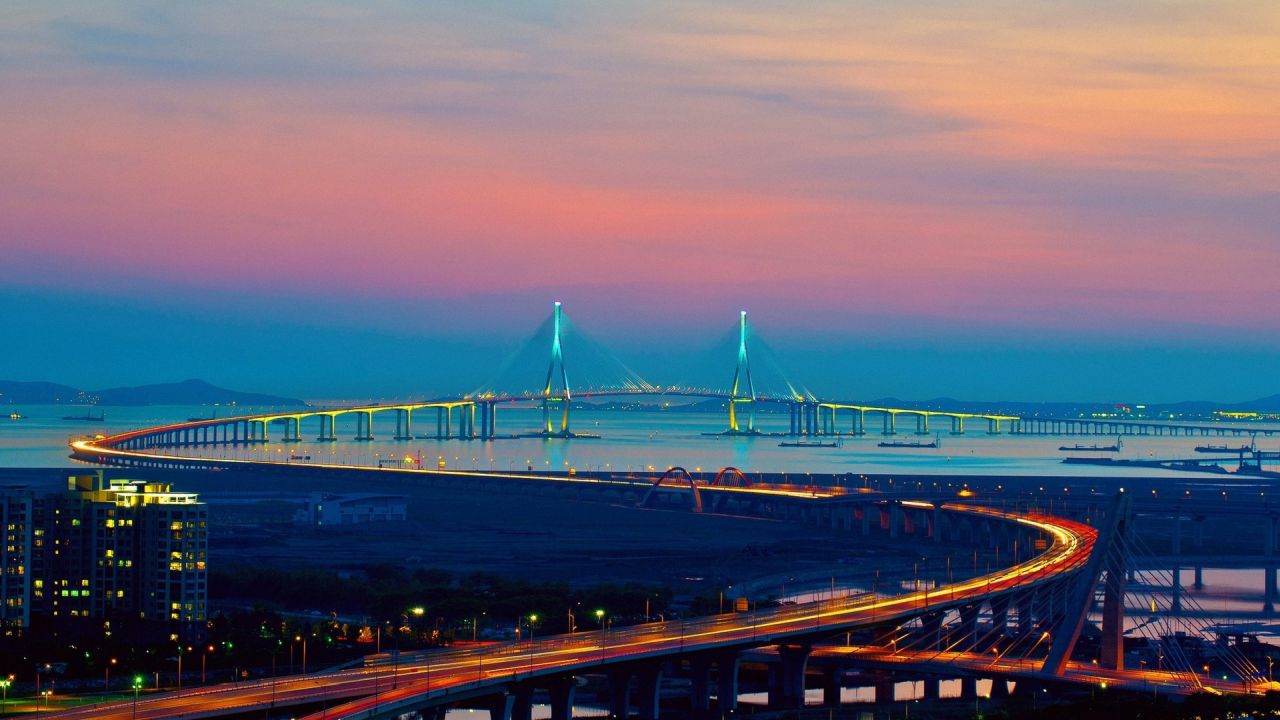 Illuminated Incheon Bridge at twilight