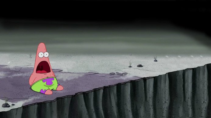 Patrick Star sitting on a cliff with a shocked expression
