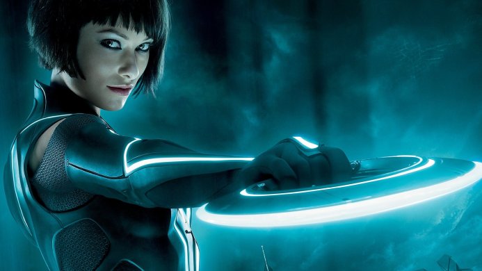 Quorra from Tron: Legacy holding her light disc, looking over her shoulder