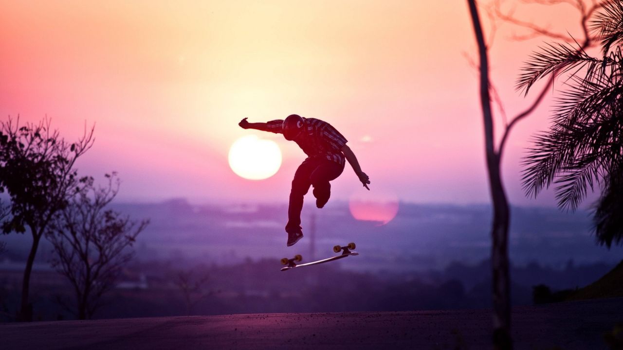 Skateboarder silhouette against the sunset