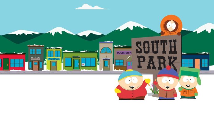 Four main characters from South Park standing in front of a cartoon town