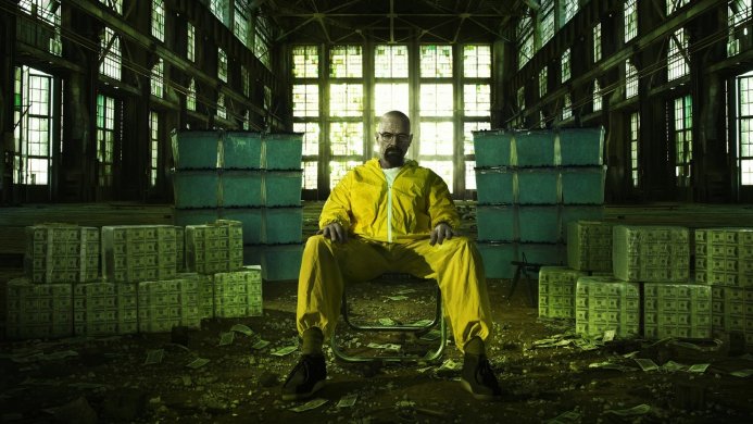Walter White in yellow suit surrounded by stacks of money and blue containers from Breaking Bad