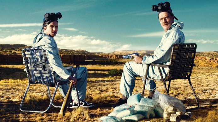 Walter White and Jesse Pinkman from Breaking Bad sitting in the desert with a gun and meth