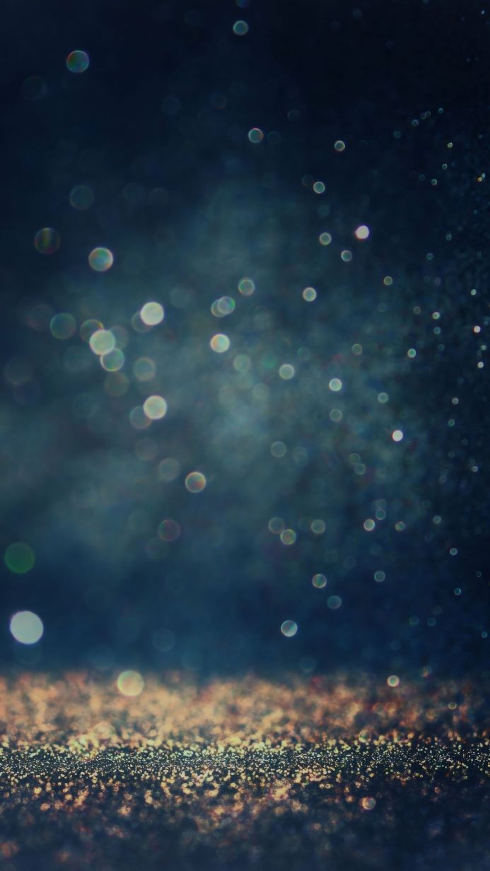 Abstract image of blurred bokeh lights in blue and gold tones