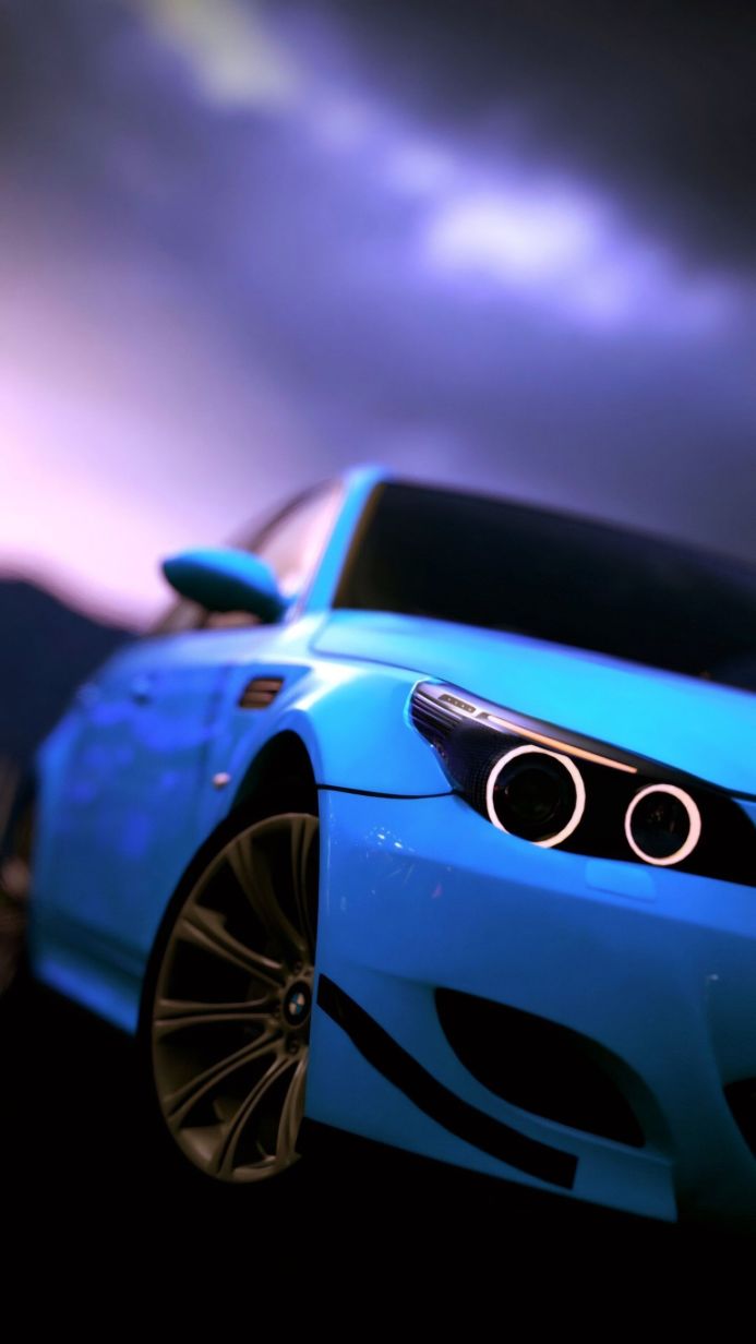 Blue BMW car with unique headlight design and silver rims