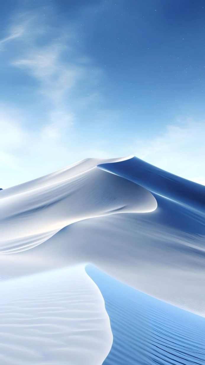 Sand dunes under a blue sky with light clouds, minimalist landscape