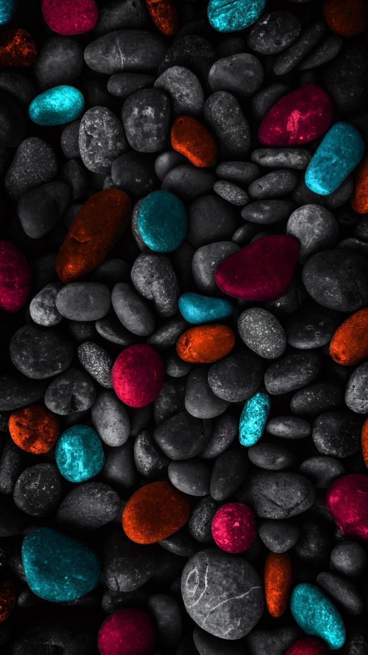 Colorful pebbles and grayscale stones texture background
