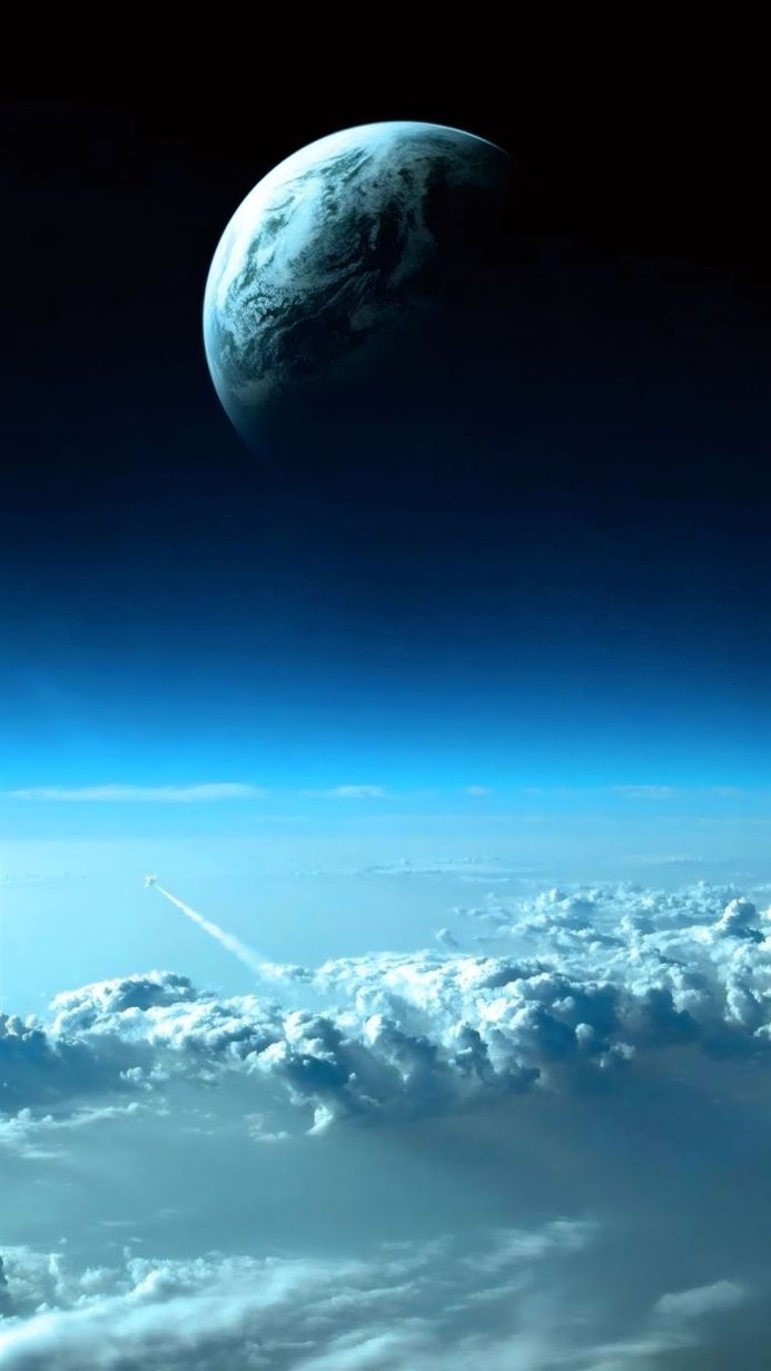 View of Earth from space with a rocket flying through the clouds