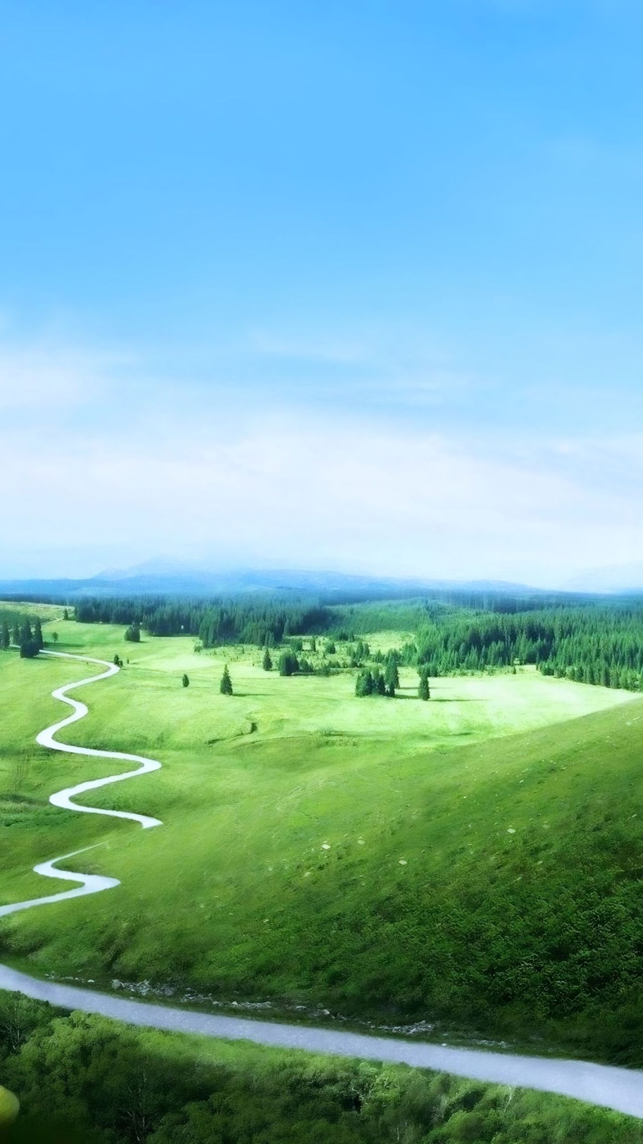 Winding road green hills forest blue sky