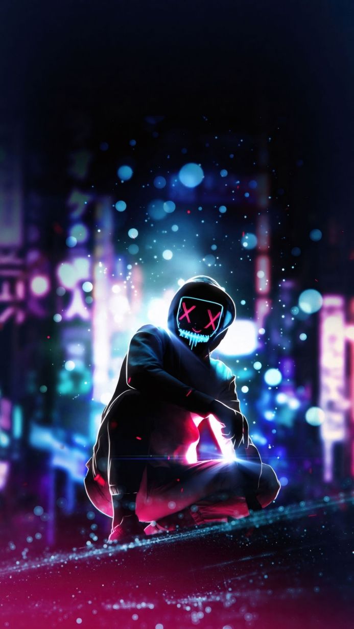 Figure in a neon-lit mask crouches against a blurred city backdrop