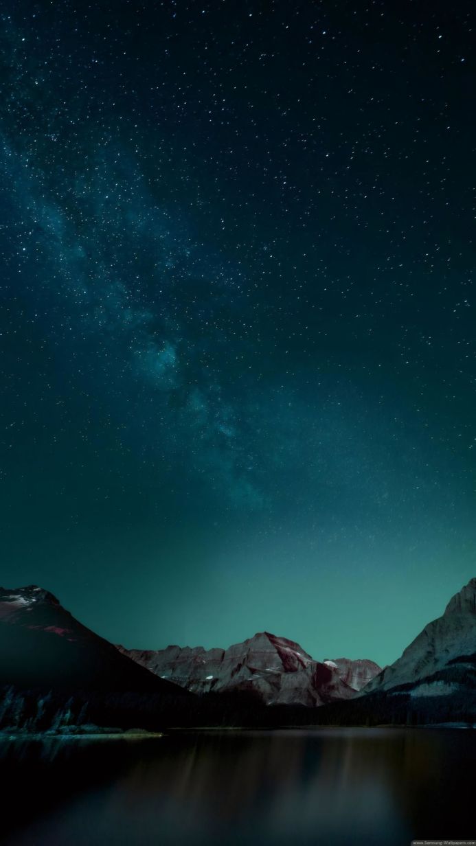 Mountains and lake under a starry sky