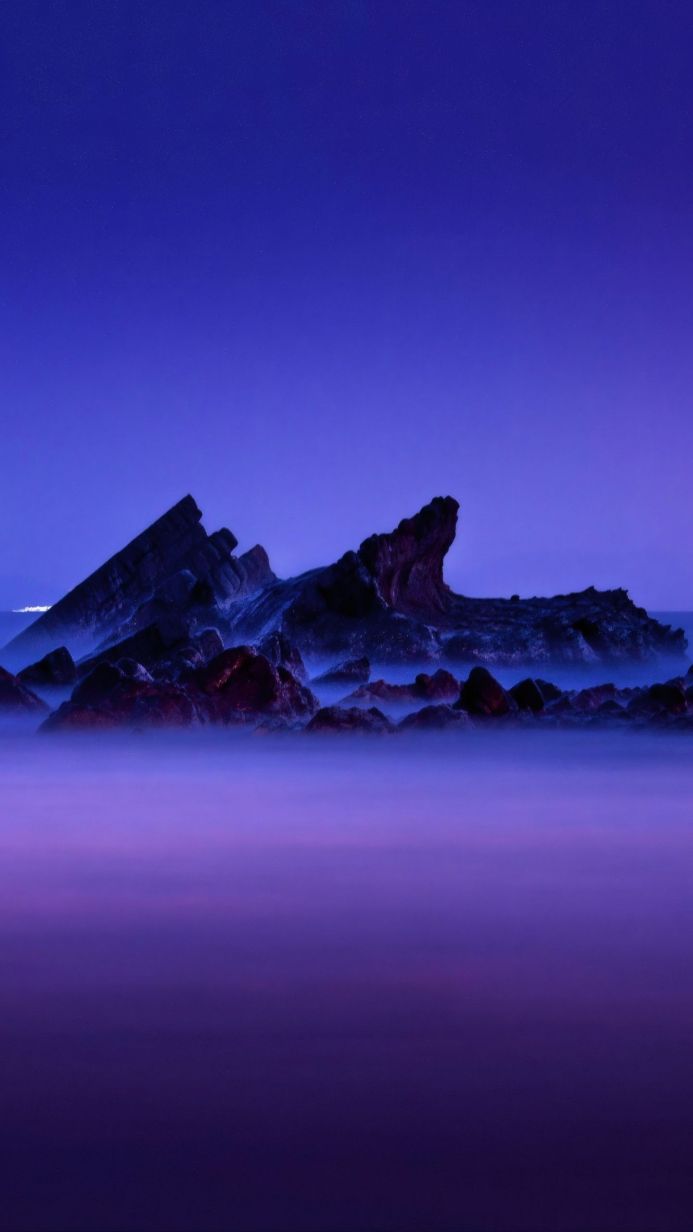 rocks in the water, long exposure, blue and purple tones