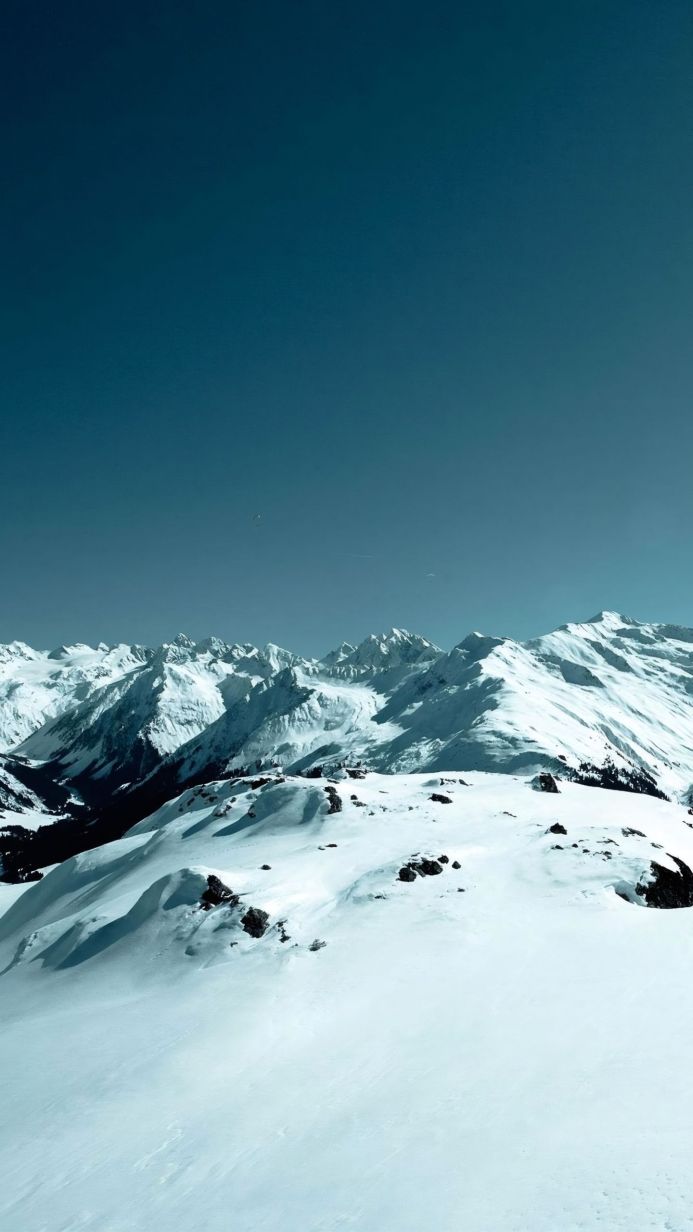 Snowy mountain range with a clear blue sky