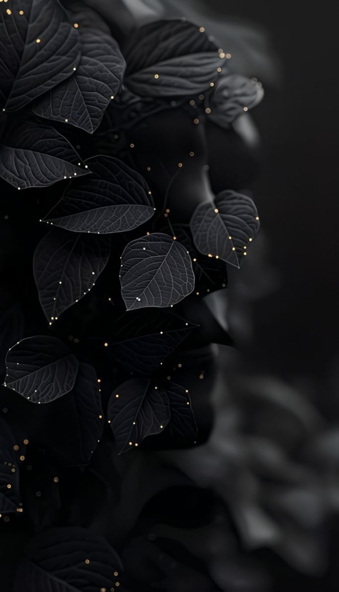 Close-up of dark leaves with small golden dots