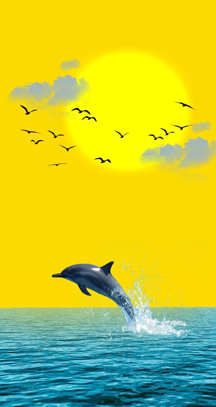 A dolphin leaping out of the water with birds flying in the sky and a bright sun