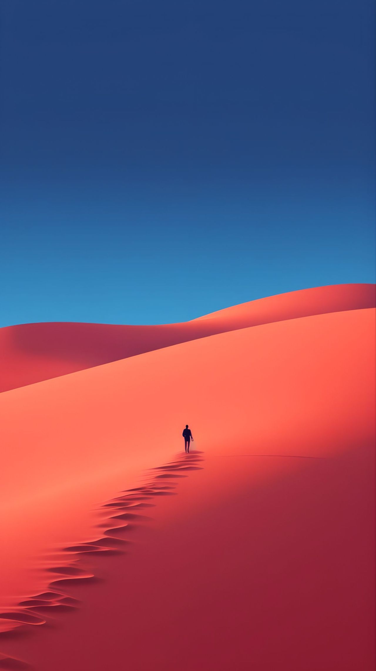 Person walking up red sand dune under blue sky
