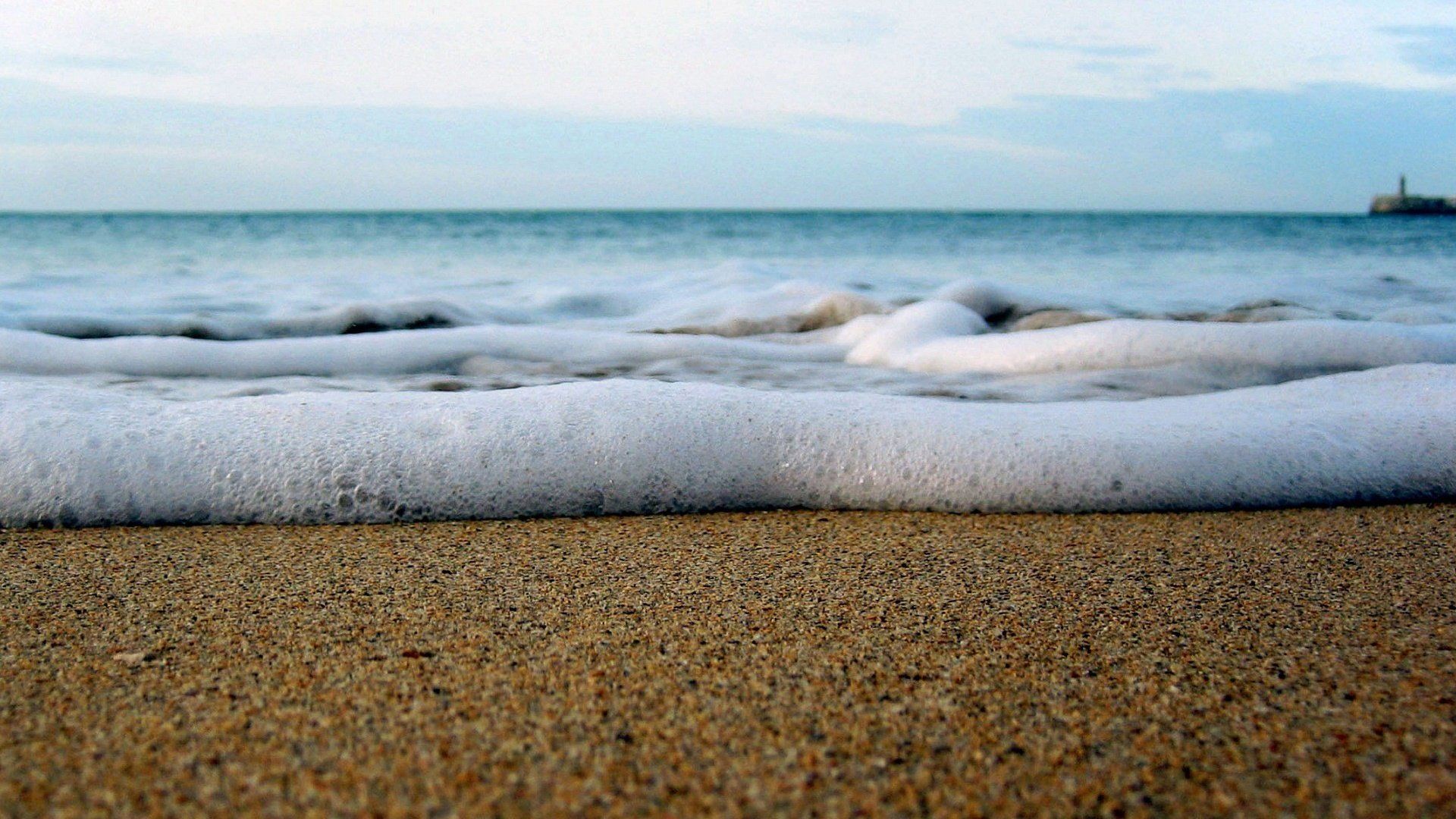 Photo Sea Sand Wave And Sea Foam