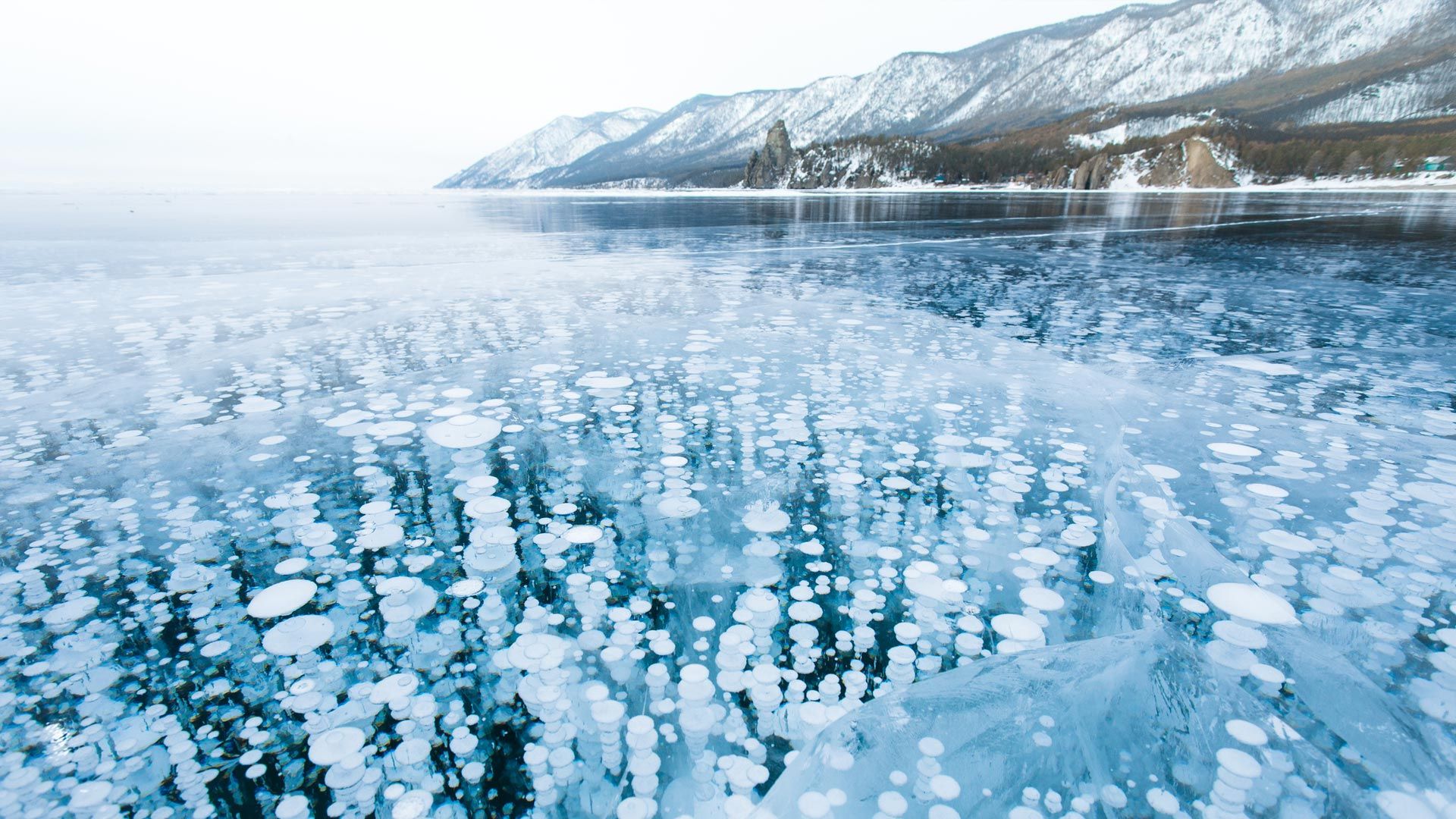 The Ice Of Lake Baikal With Bubbles
